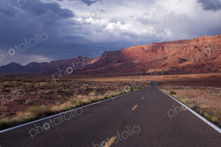 Echo Cliffs, a rock cliff formation of sandstone cliffs rising above a valley in…