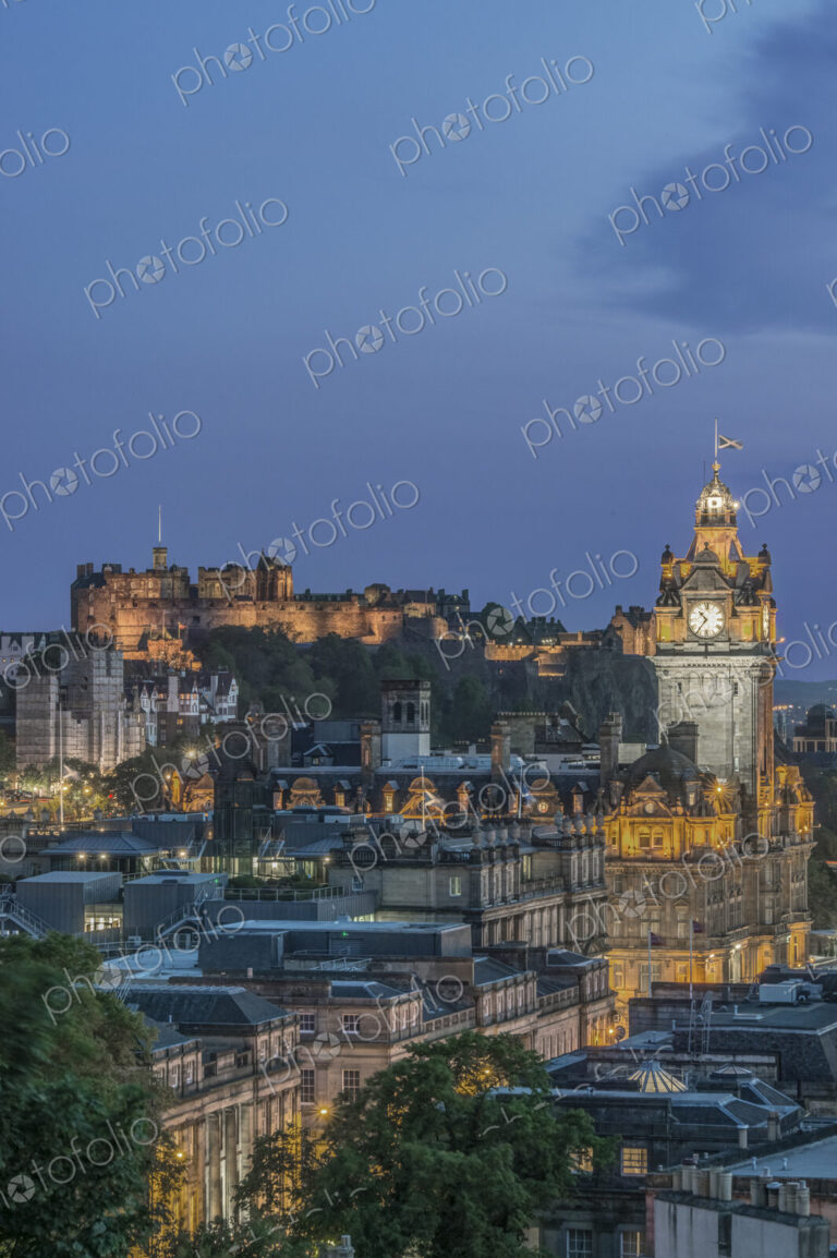Edinburgh cityscape lit up at dusk.