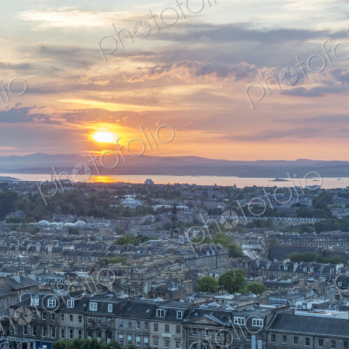 Edinburgh cityscape seen from Carlton Hill at sunset.