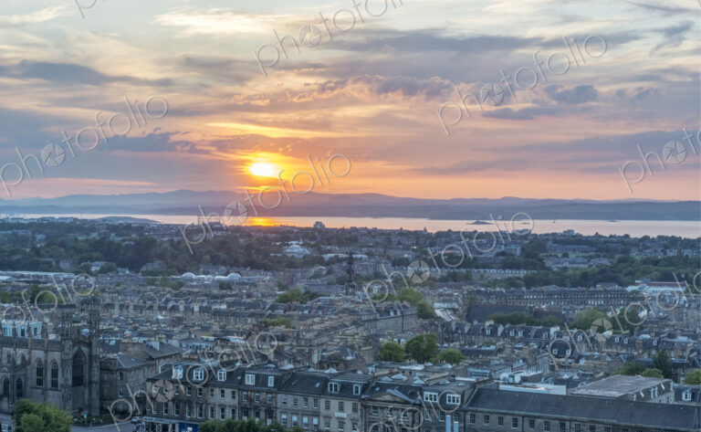Edinburgh cityscape seen from Carlton Hill at sunset.