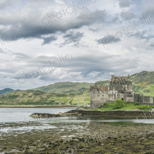 Eilan Donan, a remote castle on a tidal island with low tide. Eilan Donan, a remote castle on a tidal island with low tide.