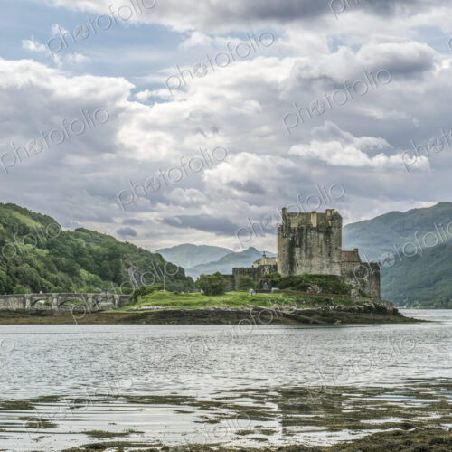 Eilean Donan, a remote Scottish castle on a tidal island, with bridge. Eilean Donan, a remote Scottish castle on a tidal island, with bridge.