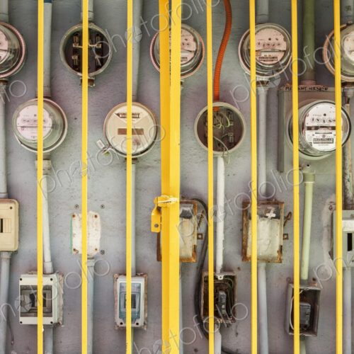 Electric meters for multiple residences behind protective iron gate, Cancun, Yucatan…