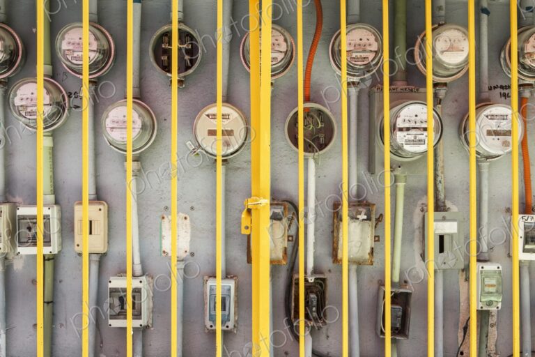 Electric meters for multiple residences behind protective iron gate, Cancun, Yucatan…