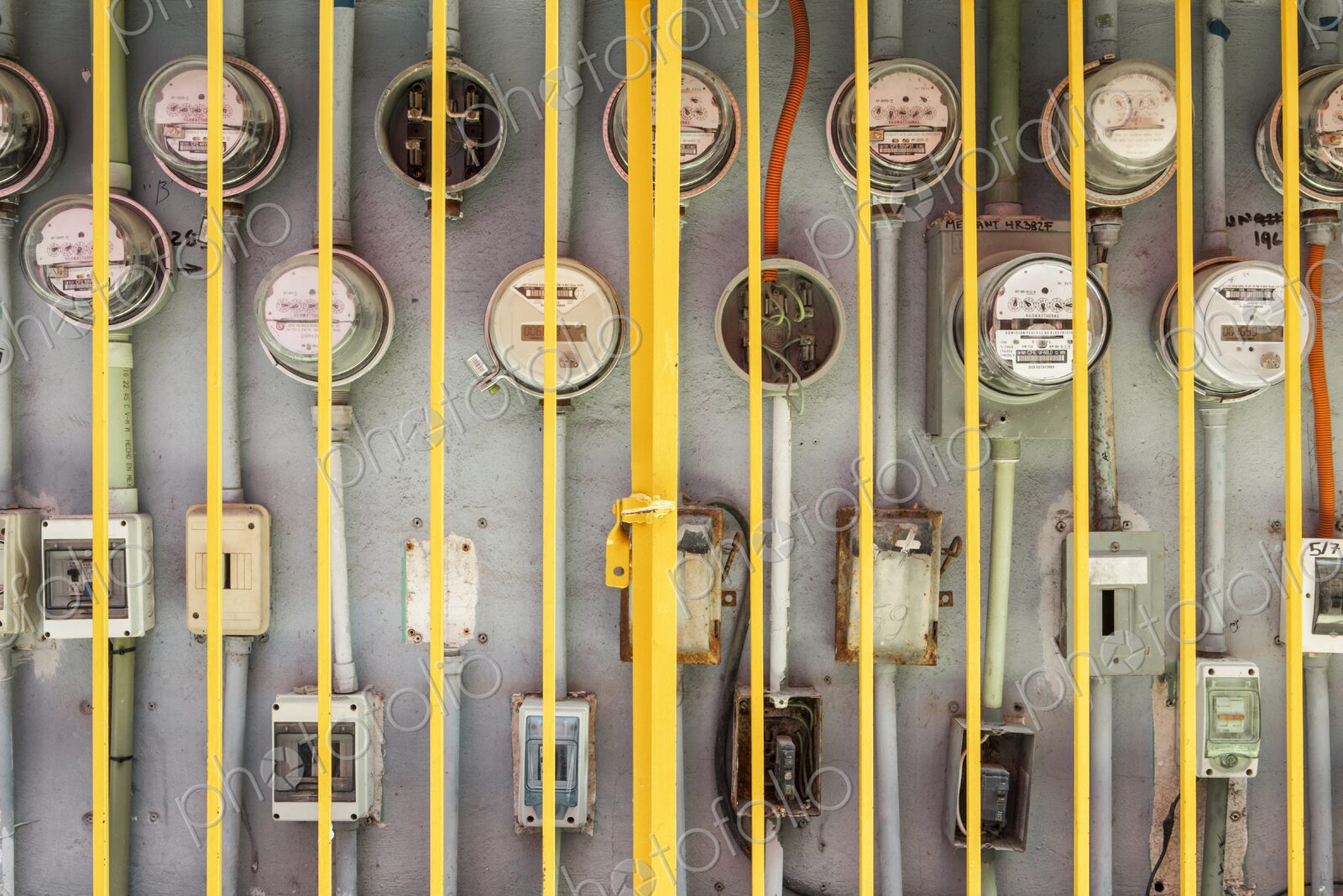 Electric meters for multiple residences behind protective iron gate, Cancun, Yucatan…
