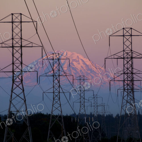 Electricity pylons near mountain landscape