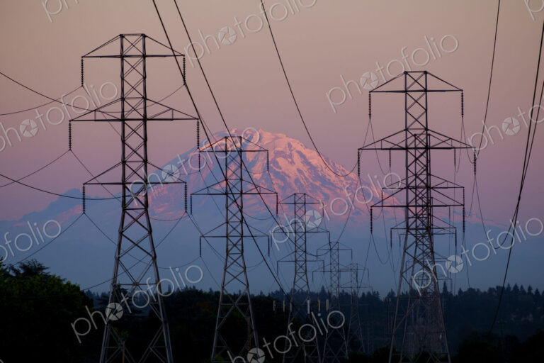 Electricity pylons near mountain landscape