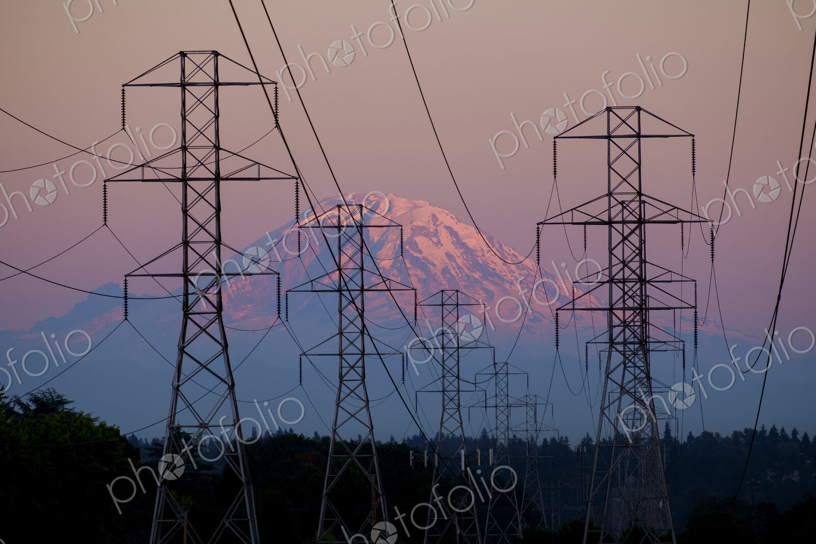 Electricity pylons near mountain landscape