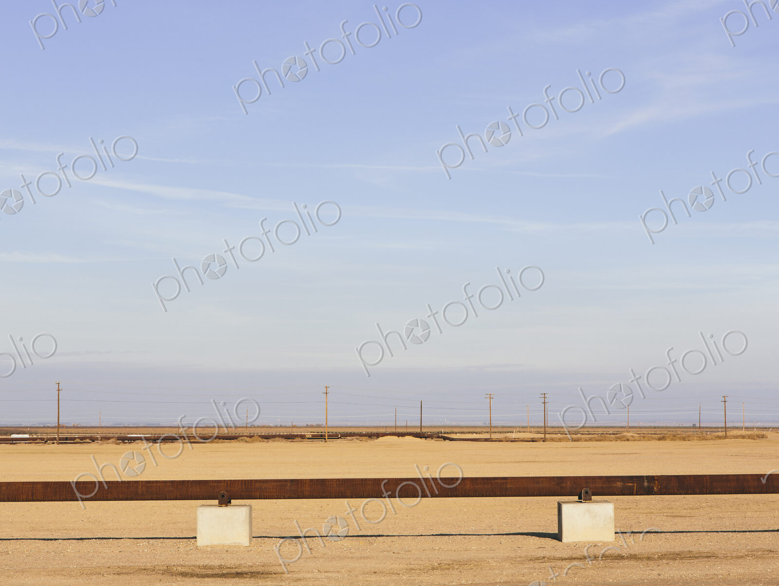 Elevated oil pipeline in the Midway-Sunset oil fields, the largest shale oil field in…