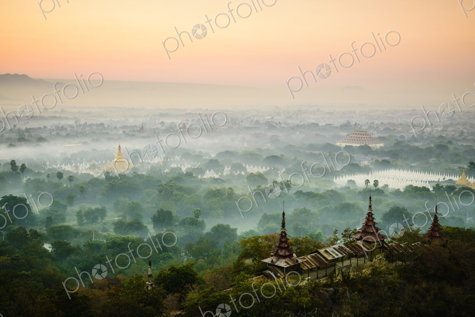 Elevated view of the plain of temples in Mandalay, stupas and spires emerging from the…