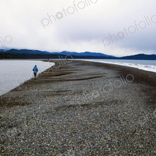 Elwha River estuary at Port Angeles, people walking along the shingle strand. Elwha River estuary at Port Angeles, people walking along the shingle strand.