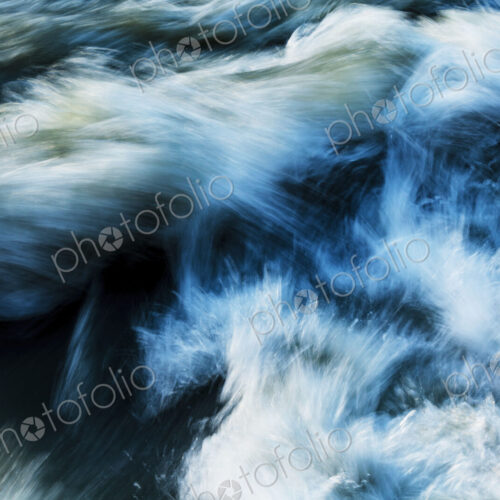 Elwha River flowing around rock, Port Angeles, WA USA
