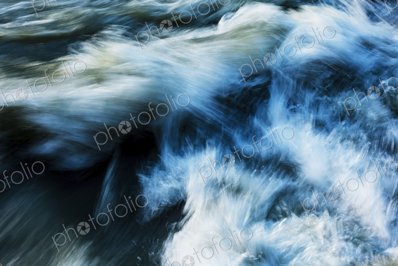 Elwha River flowing around rock, Port Angeles, WA USA