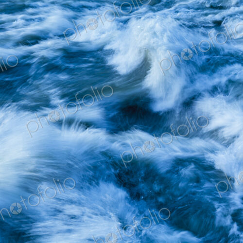 Elwha River flowing around rock, Port Angeles, WA USA