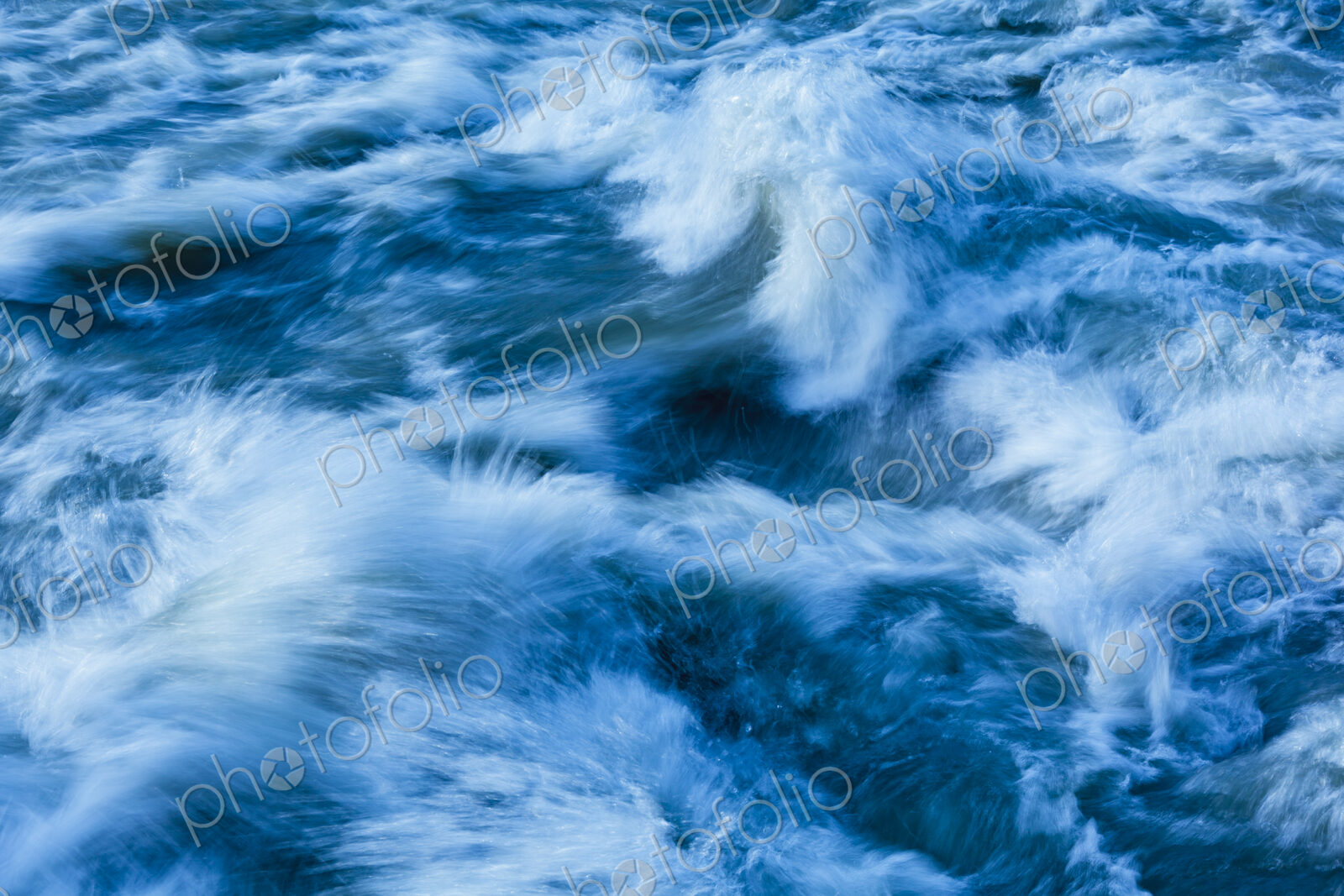 Elwha River flowing around rock, Port Angeles, WA USA