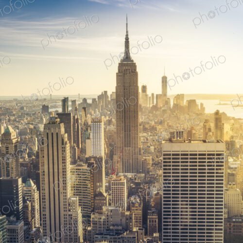 Empire State Building rising above Manhattan skyline.
