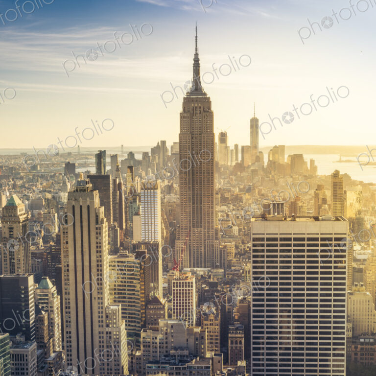 Empire State Building rising above Manhattan skyline.