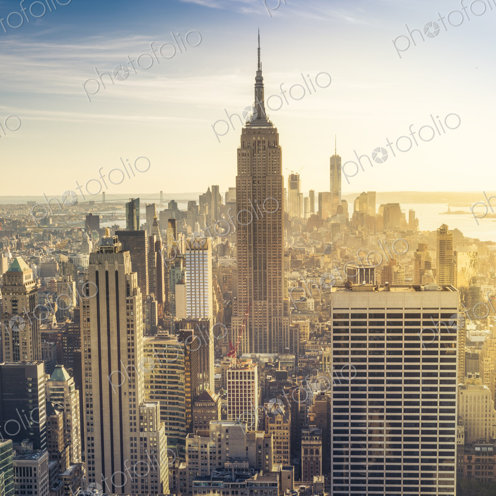 Empire State Building rising above Manhattan skyline.
