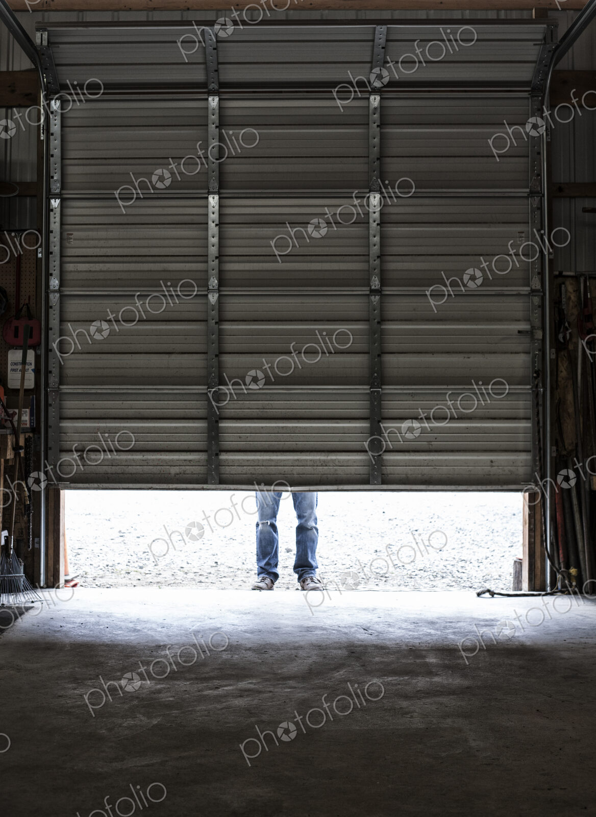 Employee coming to work walking in a loading dock doorway.