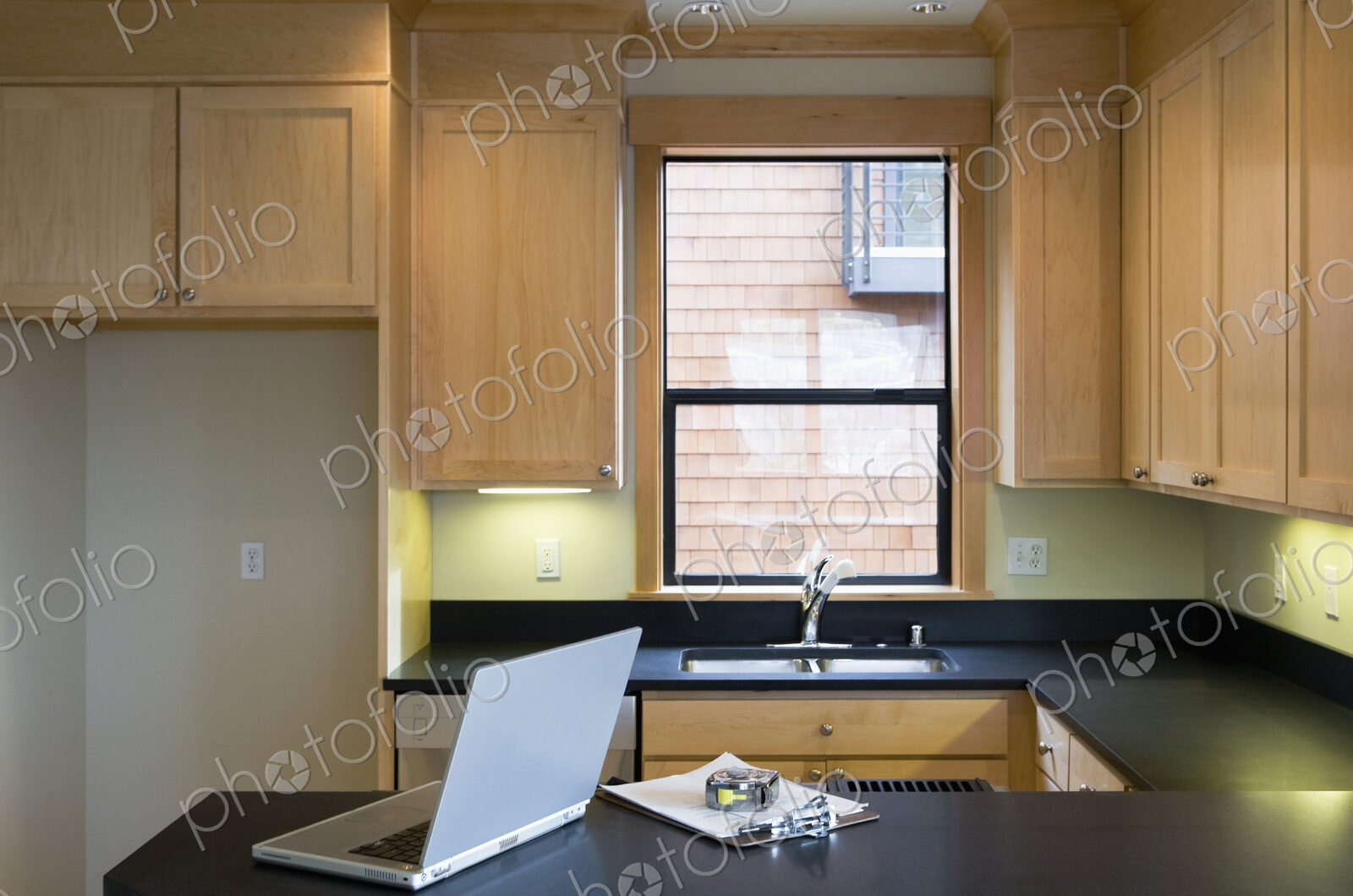 Empty Kitchen With Laptop