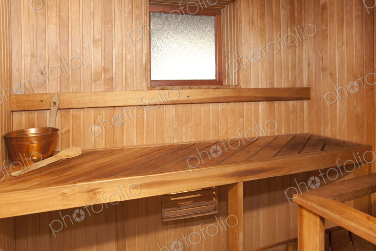 Empty Spa sauna interior, wooden clad walls and seating.