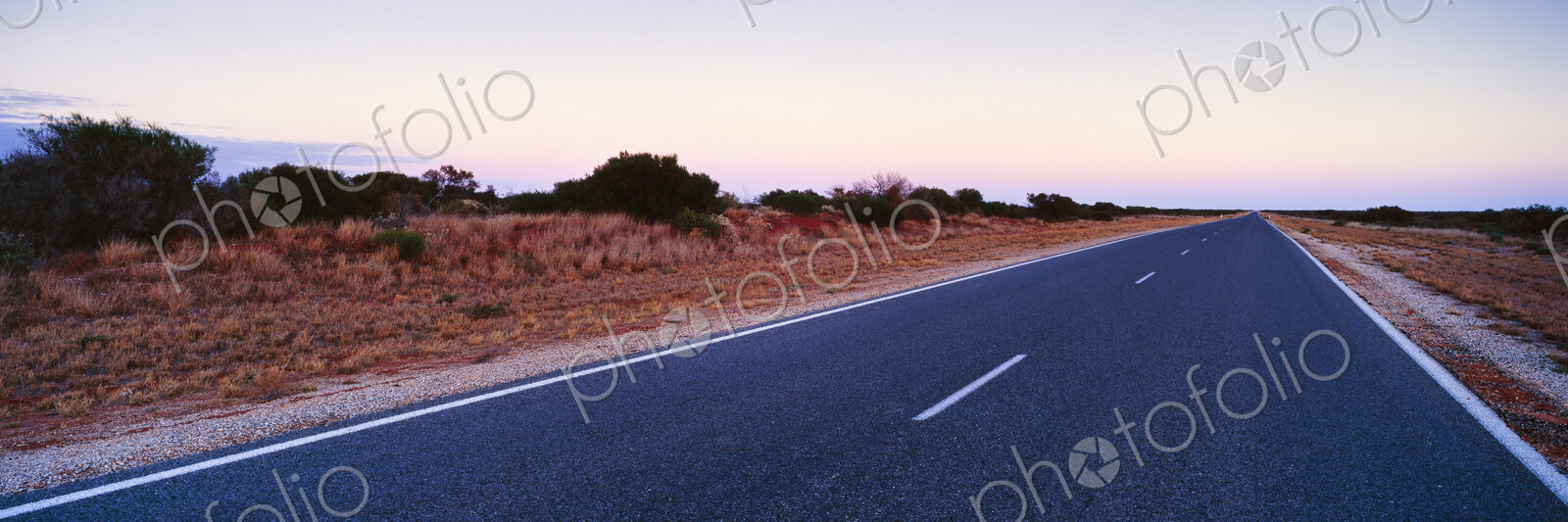 Empty Two Lane Highway at Dawn