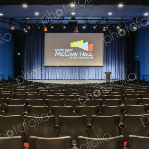 Empty auditorium, rows of raked seats. Empty auditorium, rows of raked seats.