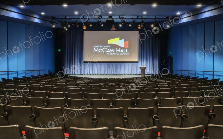 Empty auditorium, rows of raked seats.