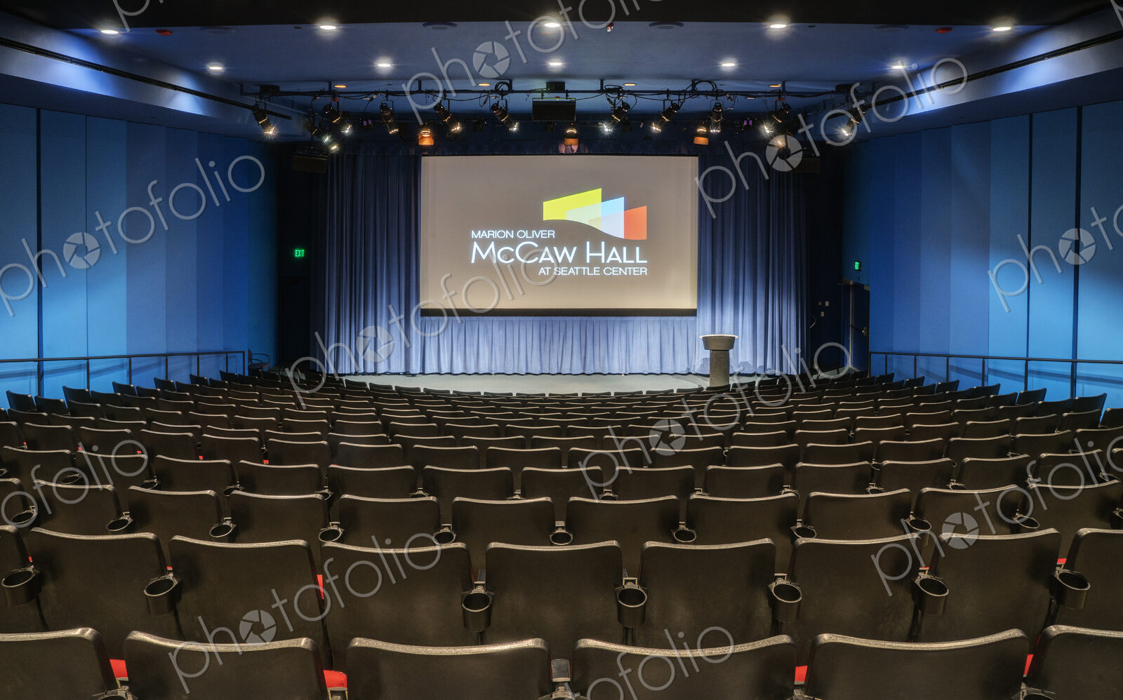 Empty auditorium, rows of raked seats.