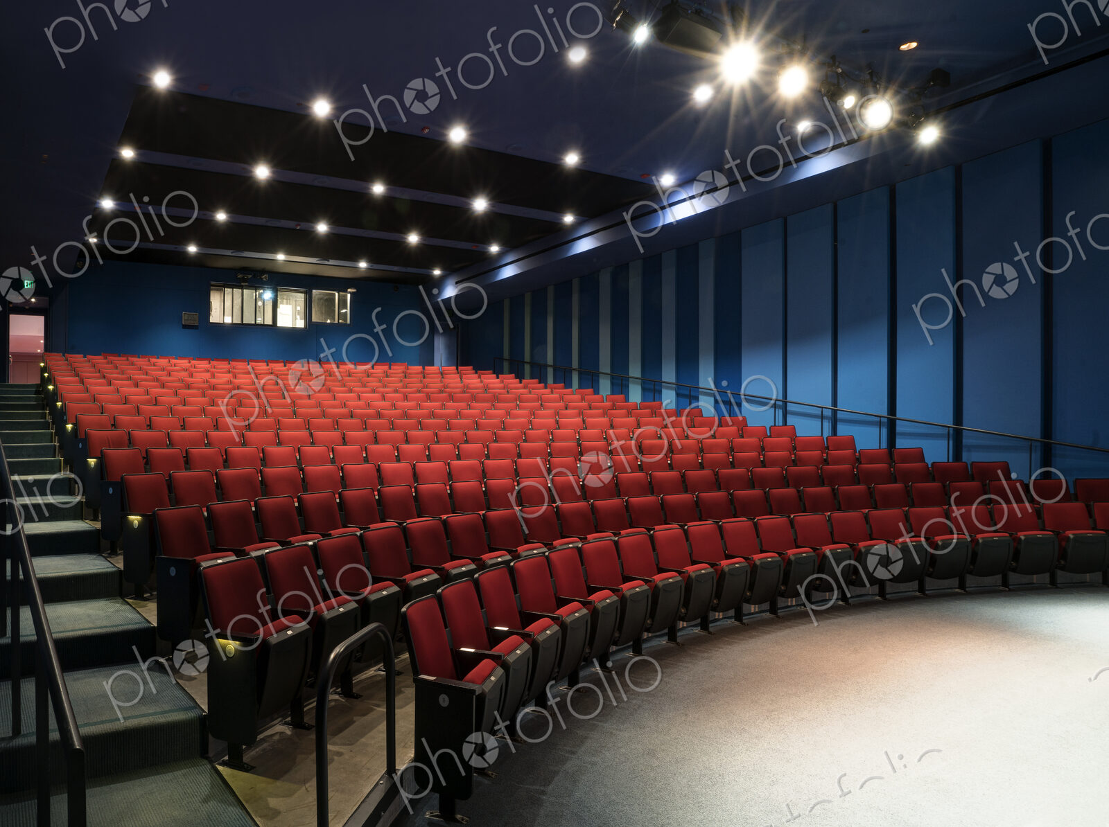 Empty auditorium, rows of raked seats.