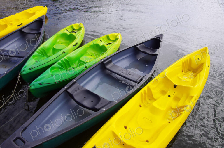 Empty canoes mooring on lake