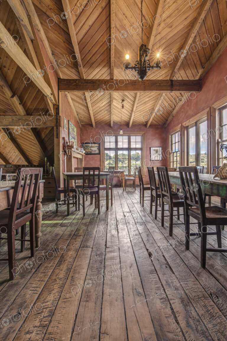 Empty chairs and tables in restaurant