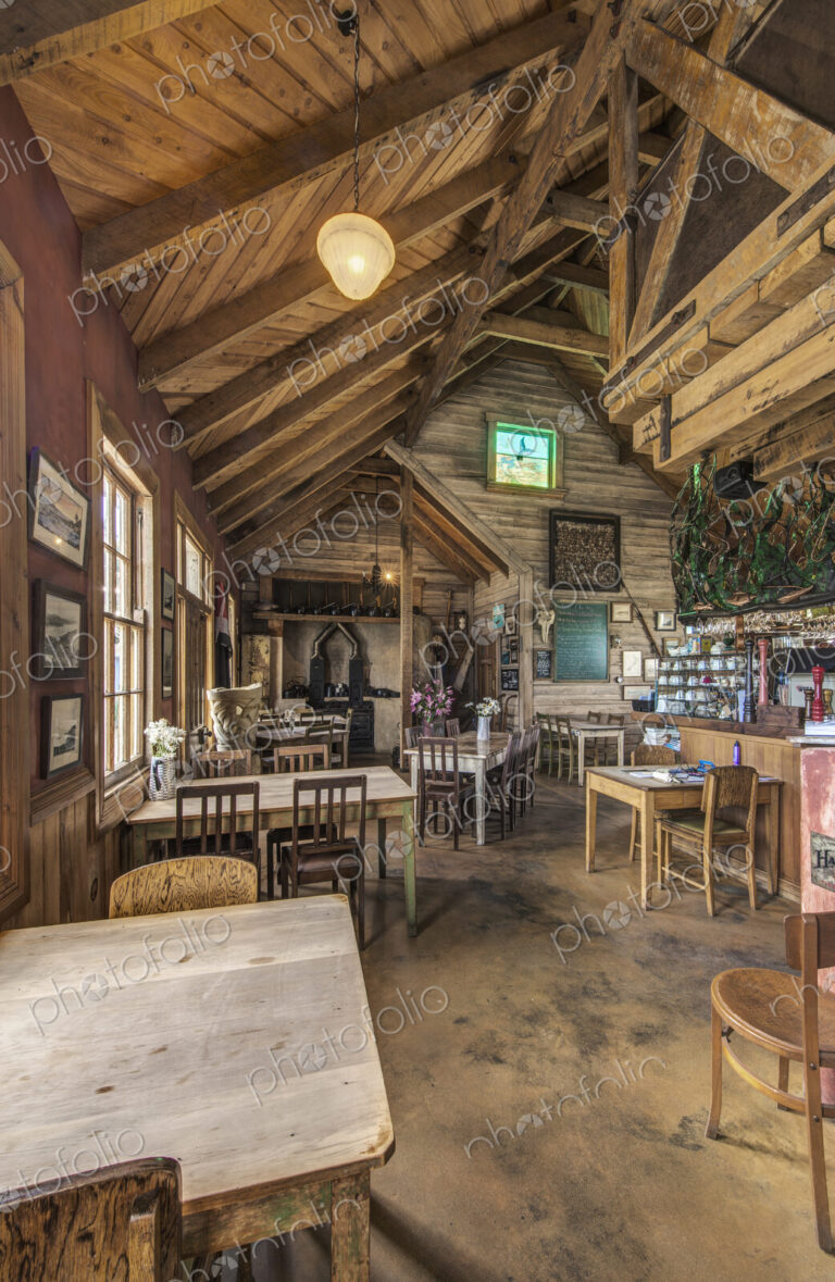 Empty chairs and tables in restaurant