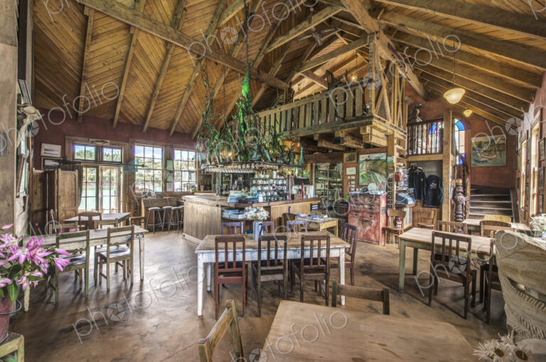 Empty chairs and tables in restaurant
