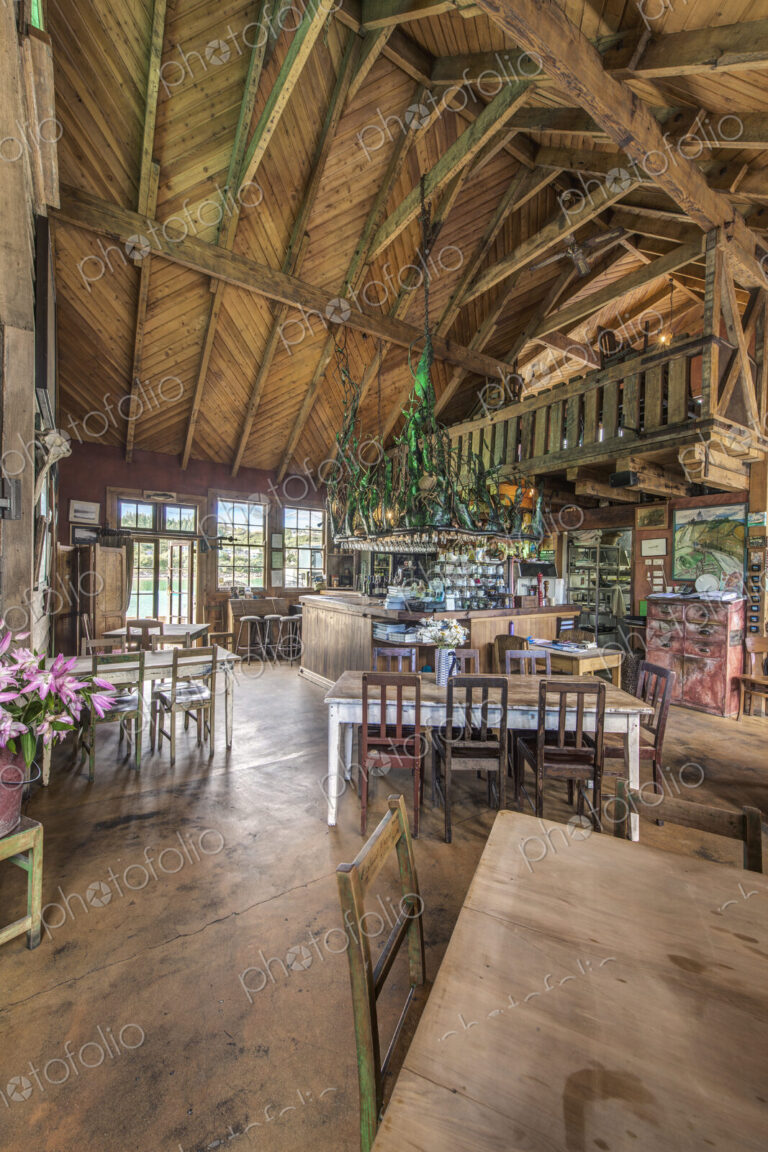 Empty chairs and tables in restaurant