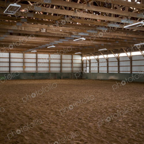 Empty indoor horse riding ring Empty indoor horse riding ring