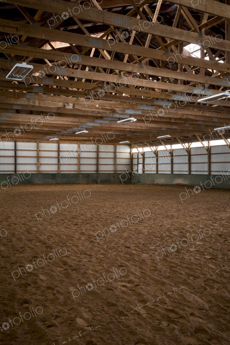 Empty indoor horse riding ring