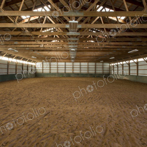 Empty indoor horse riding ring Empty indoor horse riding ring