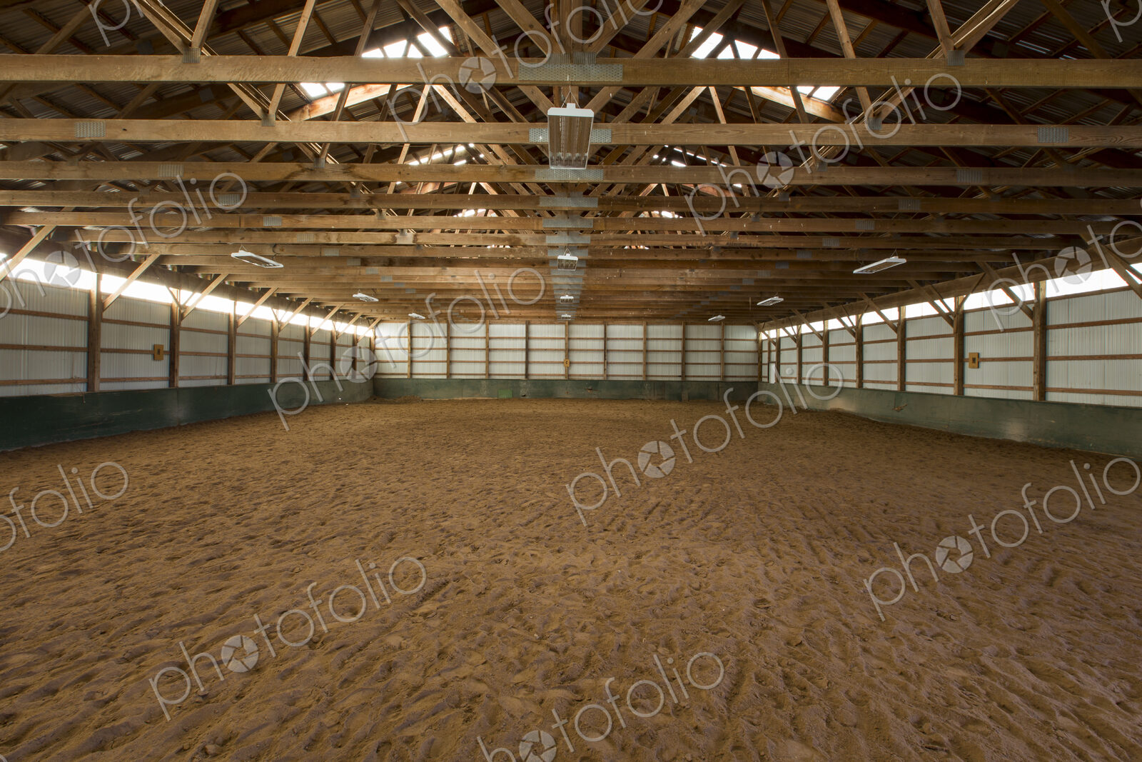 Empty indoor horse riding ring