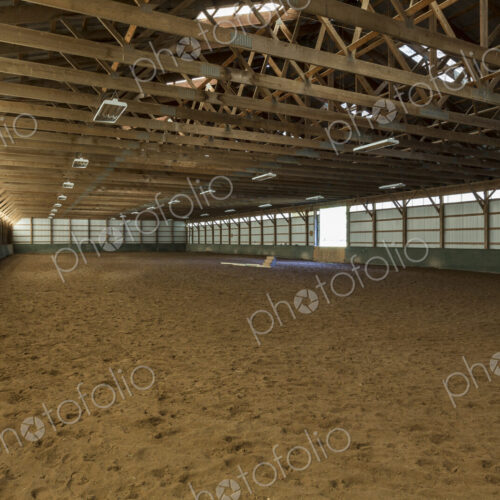 Empty indoor horse riding ring Empty indoor horse riding ring