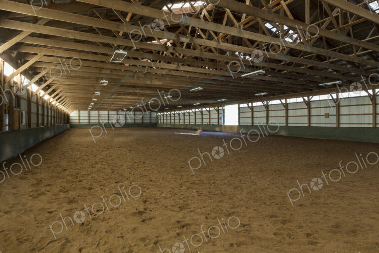 Empty indoor horse riding ring