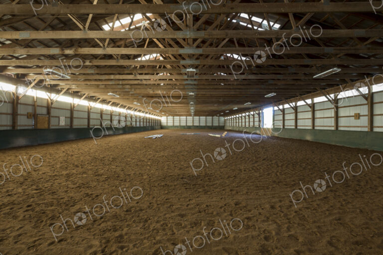 Empty indoor horse riding ring