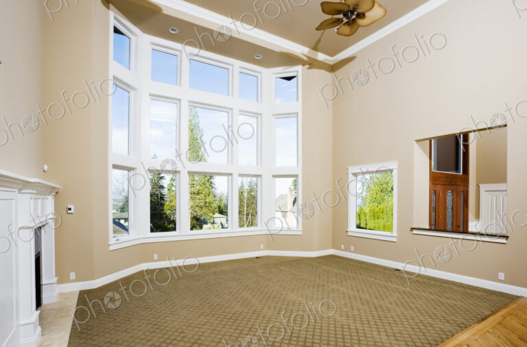 Empty living room with large windows