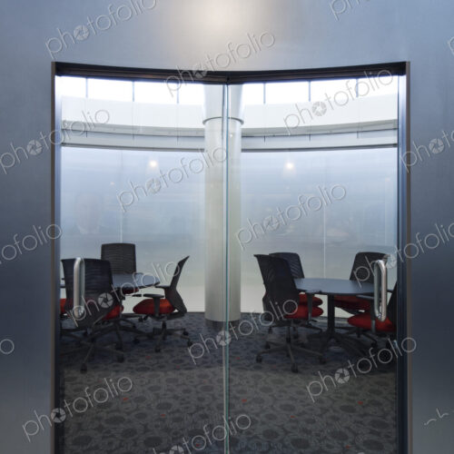 Empty meeting room with glass doors.