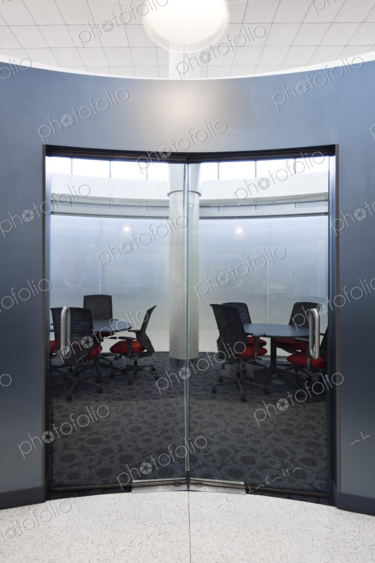 Empty meeting room with glass doors.