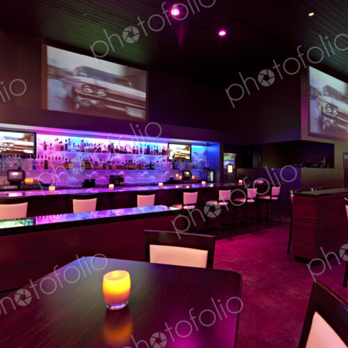 Empty nightclub illuminated with pink and purple light Empty nightclub illuminated with pink and purple light