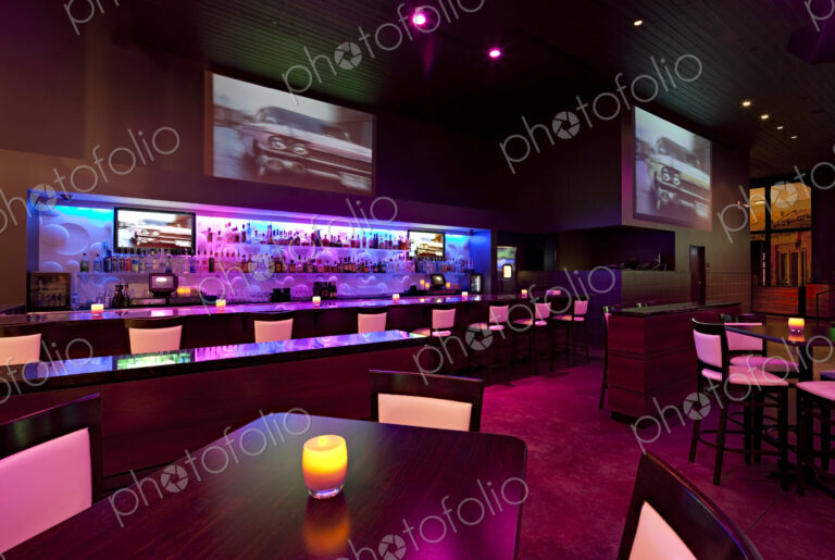 Empty nightclub illuminated with pink and purple light
