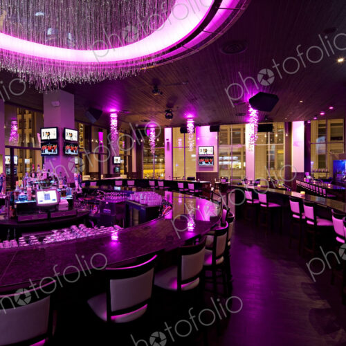 Empty nightclub illuminated with purple neon light Empty nightclub illuminated with purple neon light