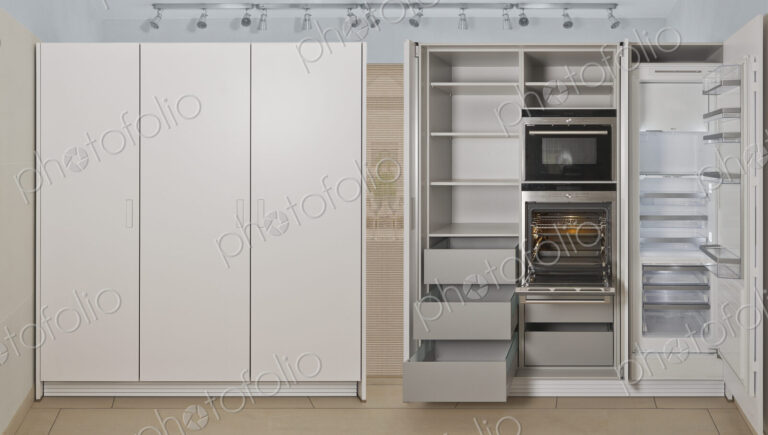 Empty refrigerator and cabinet storage in modern kitchen