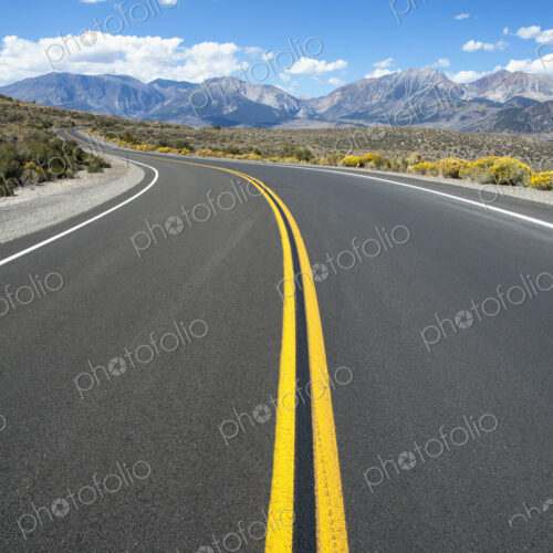 Empty road, Highway 120, curving around corner, near Mono Lakes. Empty road, Highway 120, curving around corner, near Mono Lakes.